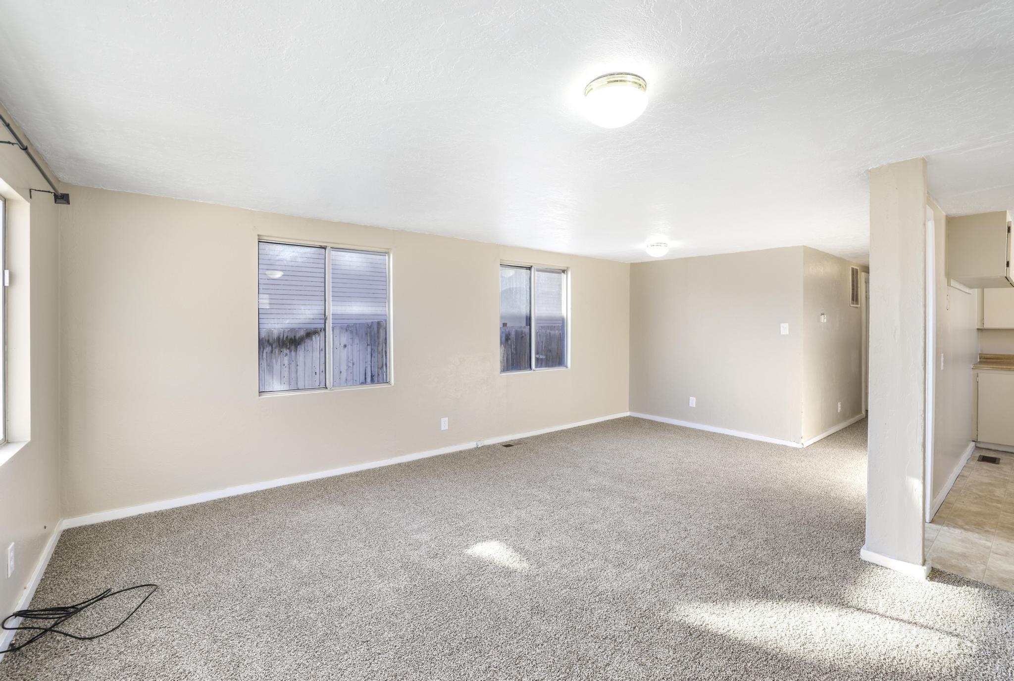 525 Adams Street Twin Falls, ID 83301 - Photo 5 of 31 Carpeted empty room with baseboards