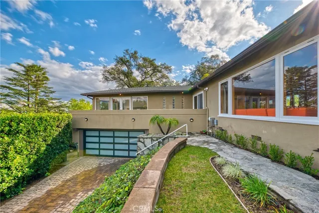 a aerial view of a house with a yard