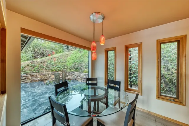 a dining room with furniture window and outdoor view