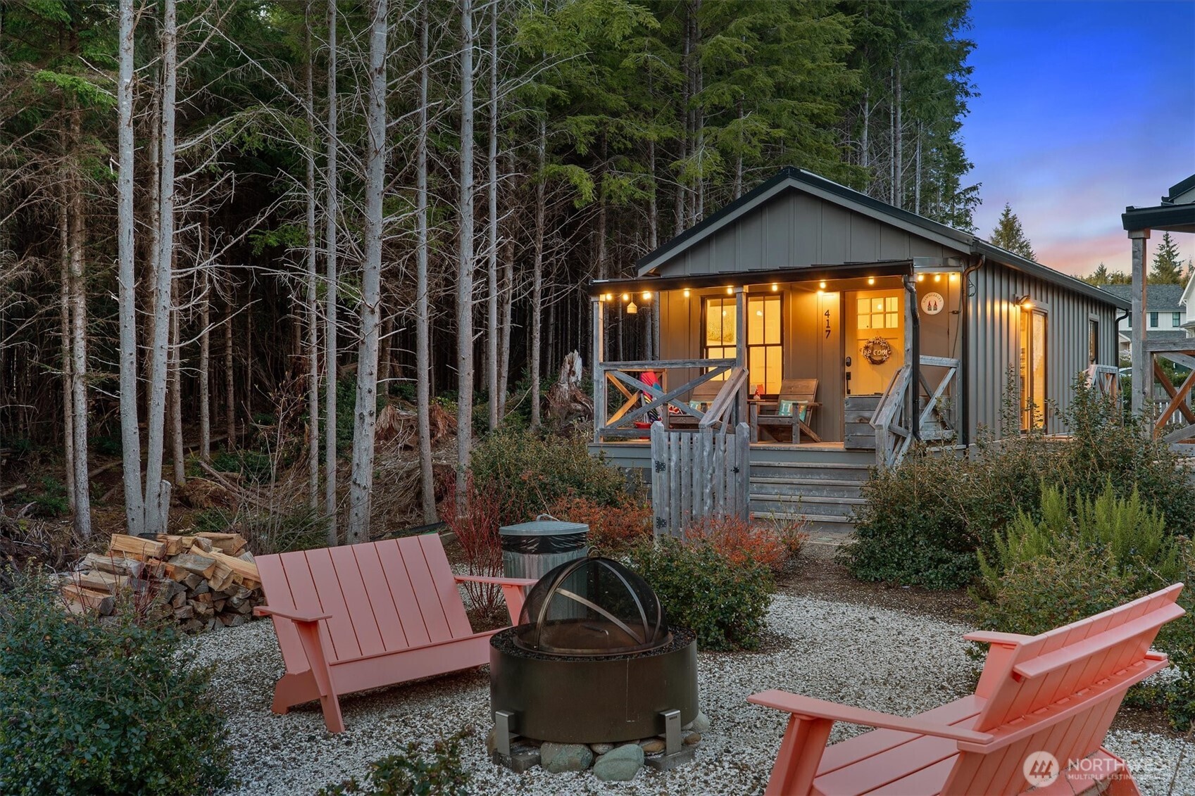 a view of a chair and table in backyard