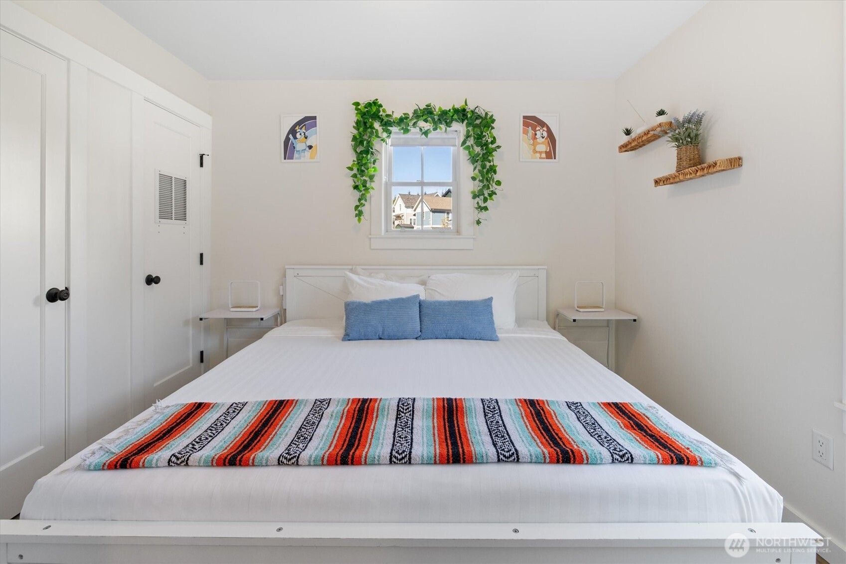 417 East Compass Street Pacific Beach, WA 98571 - Photo 13 of 40 a room with a bed and painting on the wall