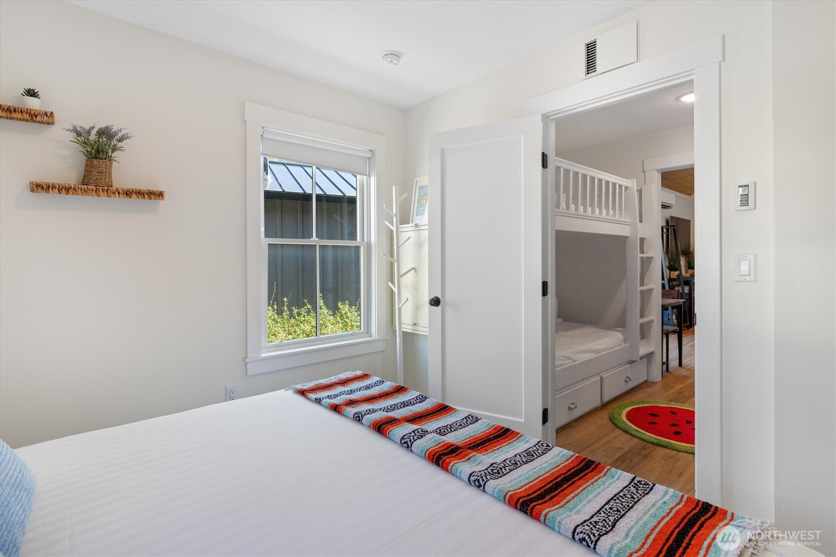 417 East Compass Street Pacific Beach, WA 98571 - Photo 14 of 40 a bedroom with a bed and a lamp