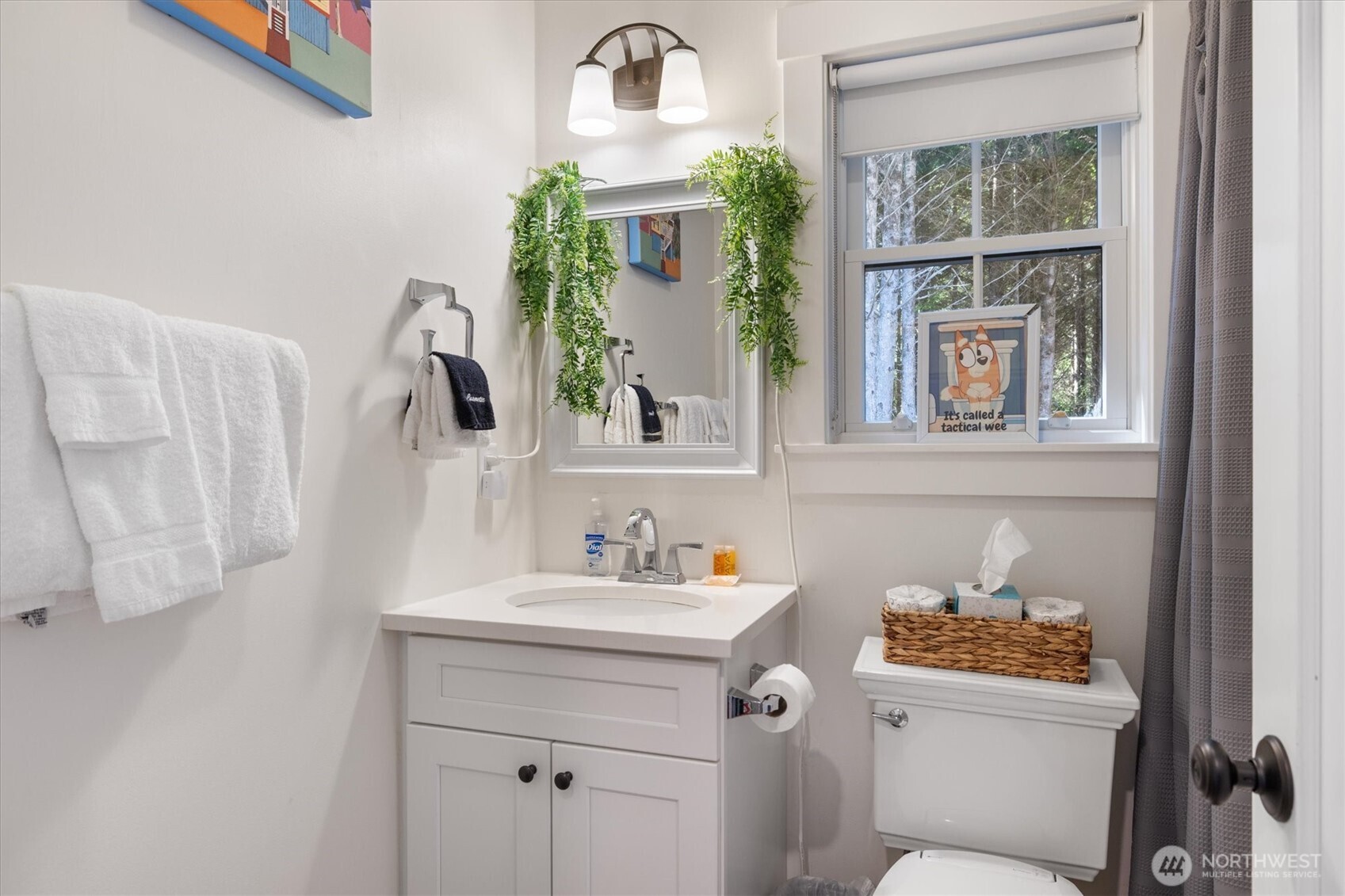 417 East Compass Street Pacific Beach, WA 98571 - Photo 16 of 40 a bathroom with a sink and a mirror
