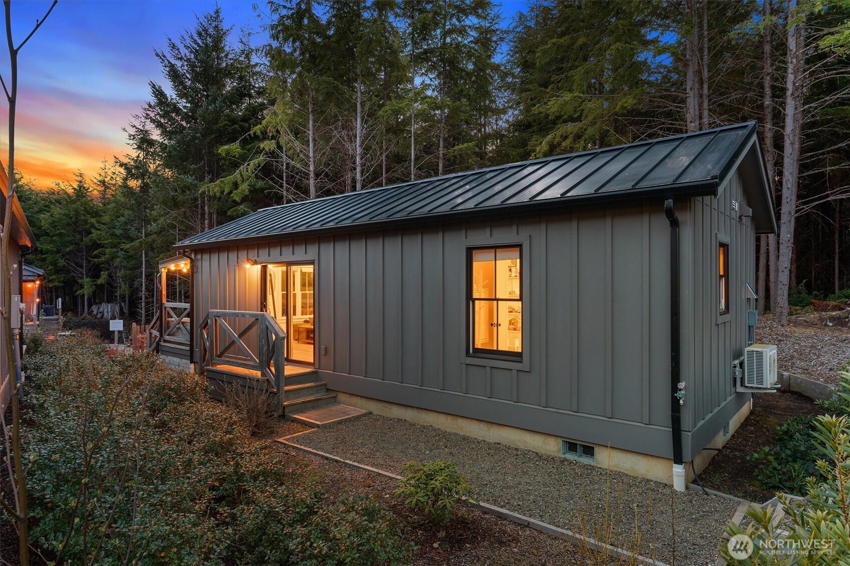 417 East Compass Street Pacific Beach, WA 98571 - Photo 21 of 40 a backyard of a house with barbeque oven table and chairs