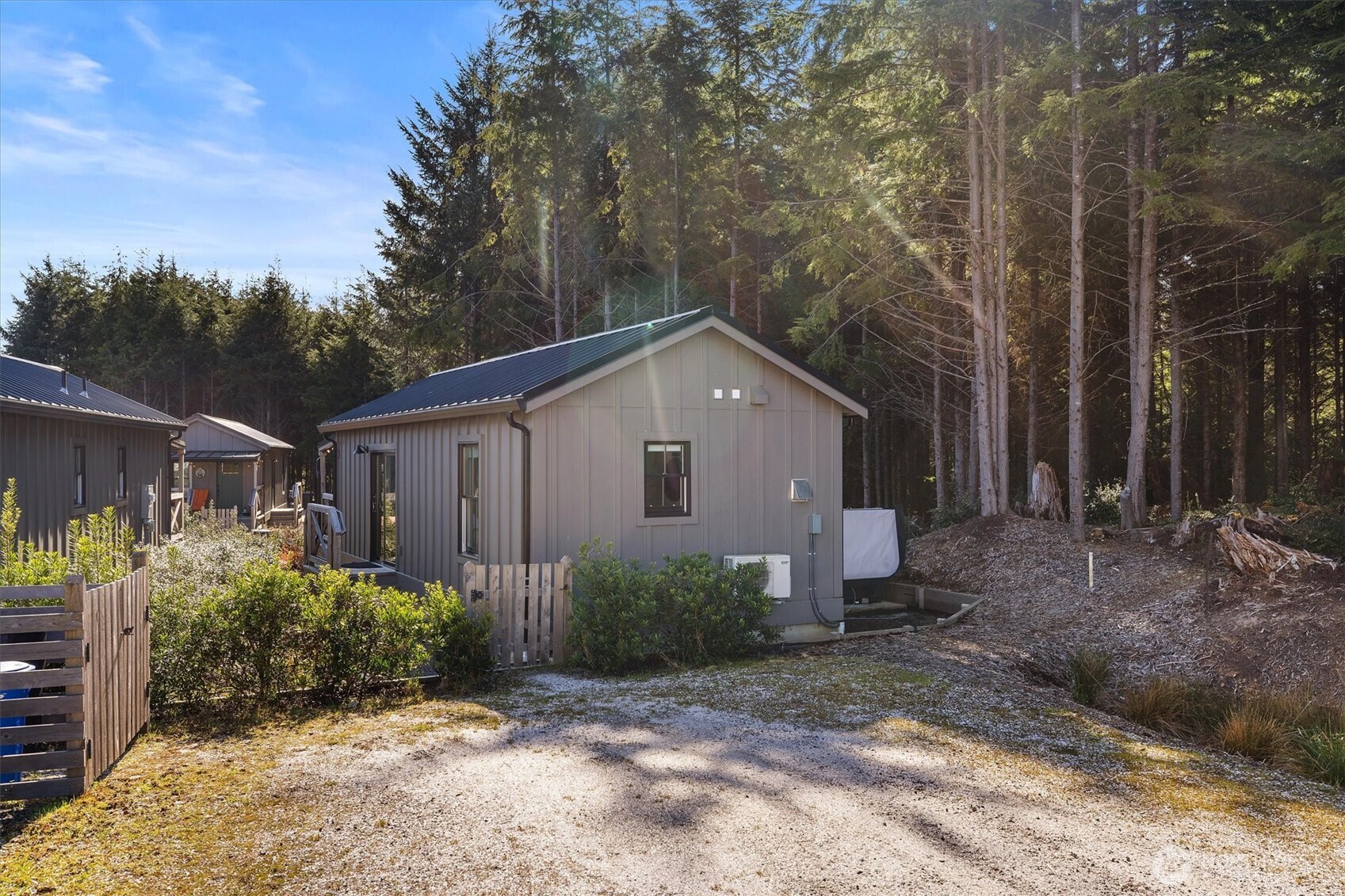 417 East Compass Street Pacific Beach, WA 98571 - Photo 24 of 40 a view of a house with backyard and garden