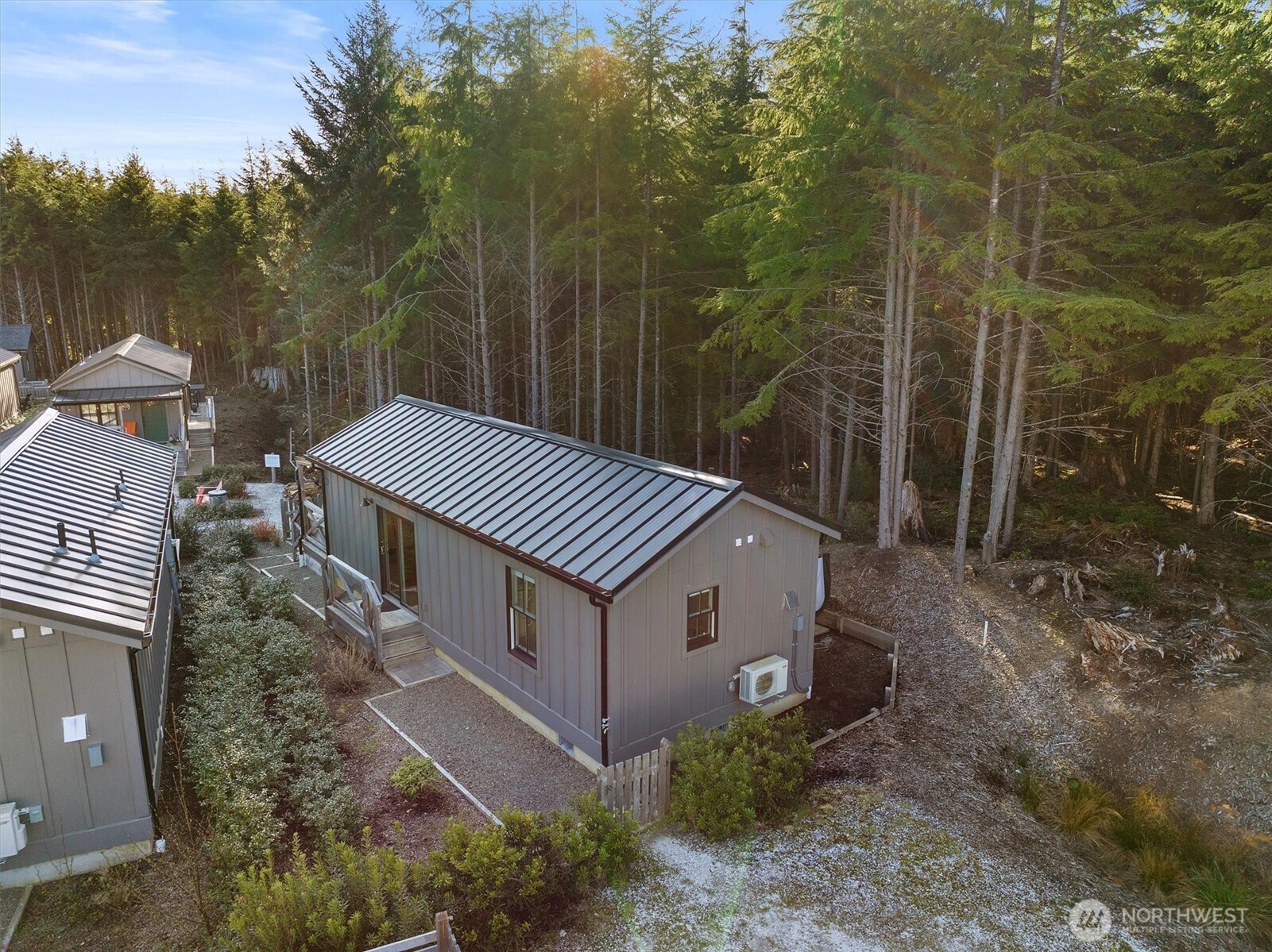 417 East Compass Street Pacific Beach, WA 98571 - Photo 26 of 40 a backyard of a house with lots of green space