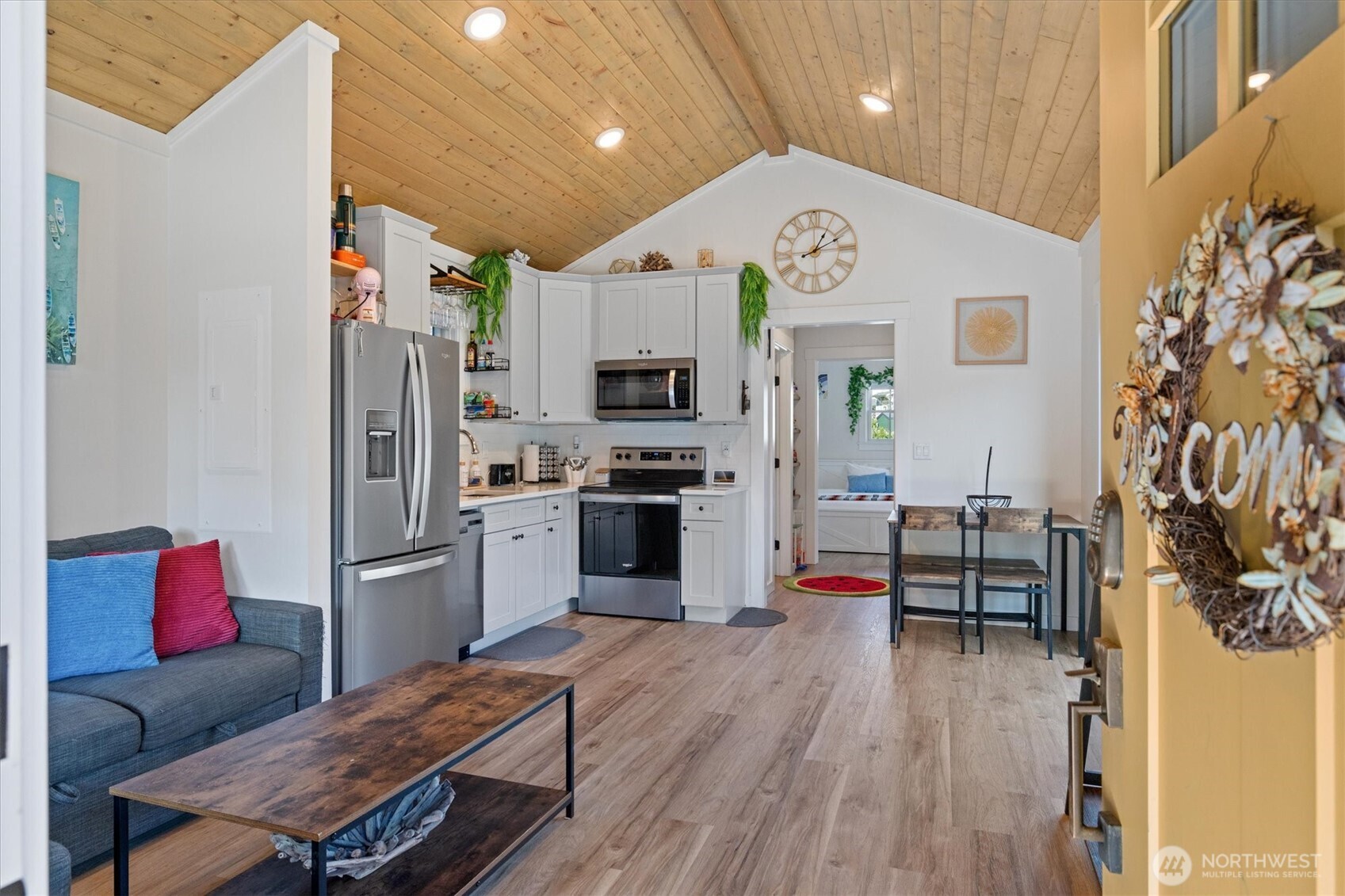 417 East Compass Street Pacific Beach, WA 98571 - Photo 4 of 40 a kitchen view with stainless steel appliances kitchen island granite countertop a refrigerator and a stove top oven