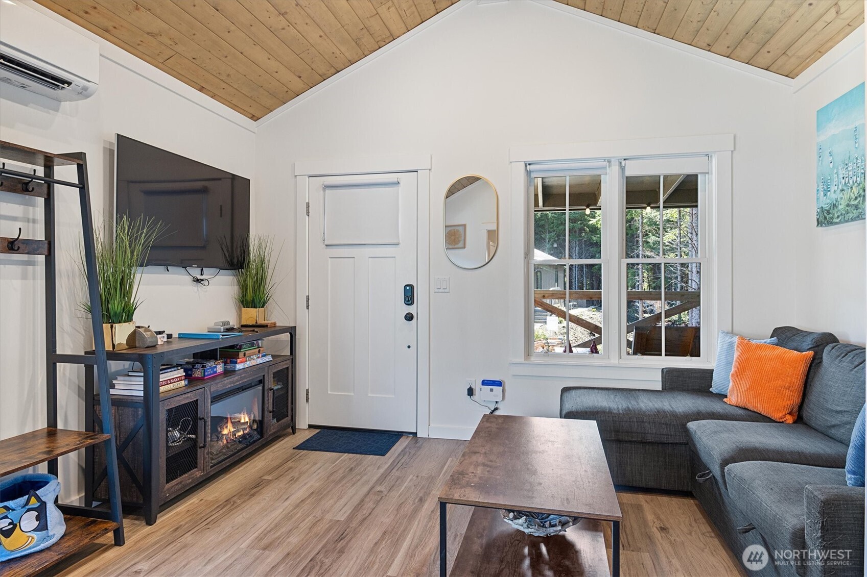 417 East Compass Street Pacific Beach, WA 98571 - Photo 5 of 40 a living room with furniture and a flat screen tv
