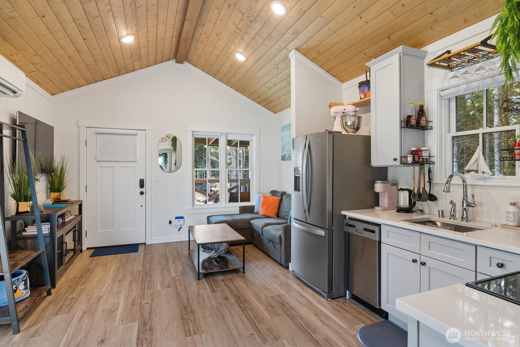 417 East Compass Street Pacific Beach, WA 98571 - Photo 6 of 40 a kitchen that has a refrigerator and a sink