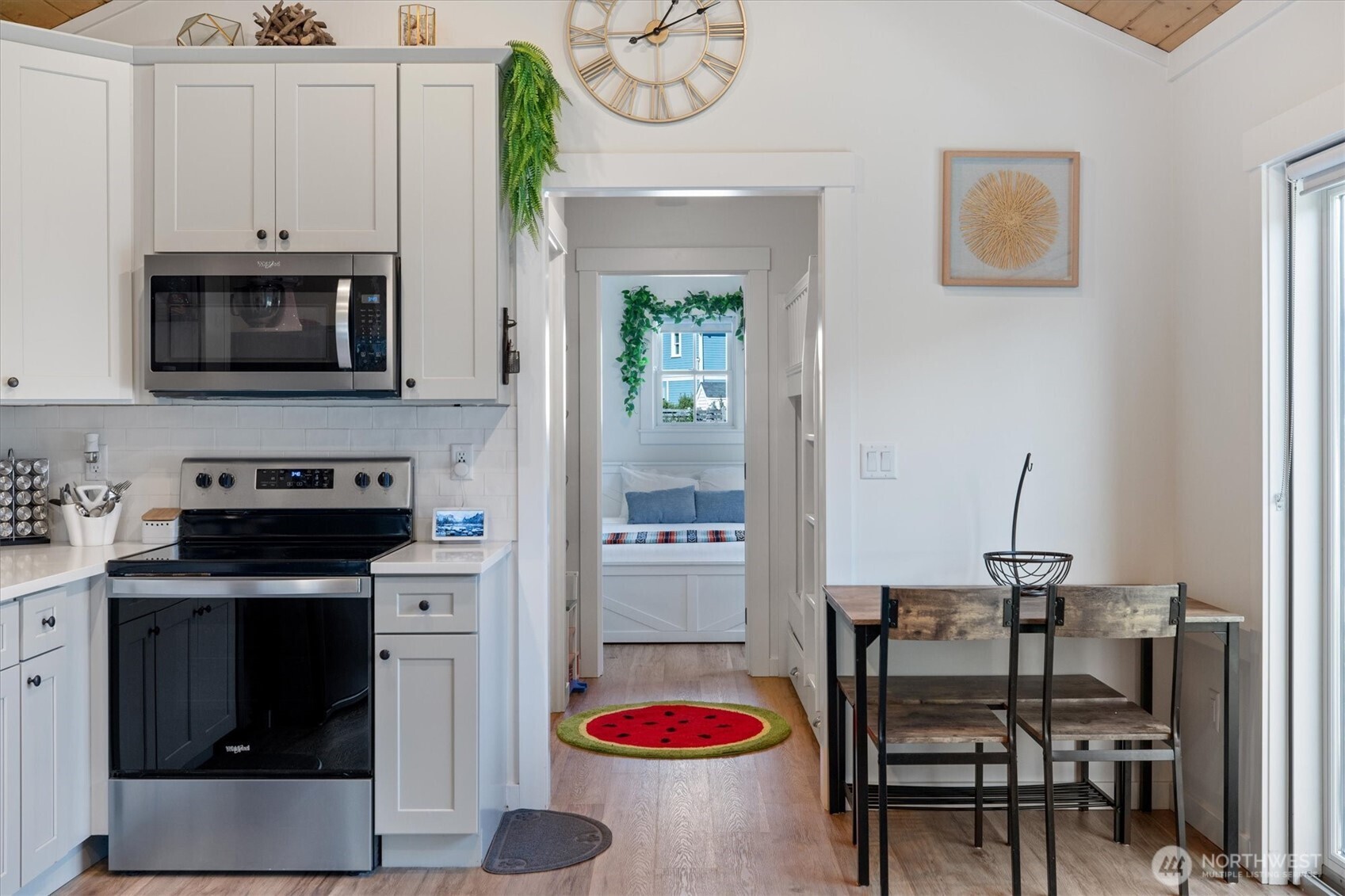 417 East Compass Street Pacific Beach, WA 98571 - Photo 8 of 40 a kitchen with stainless steel appliances kitchen island granite countertop a refrigerator and a stove top oven