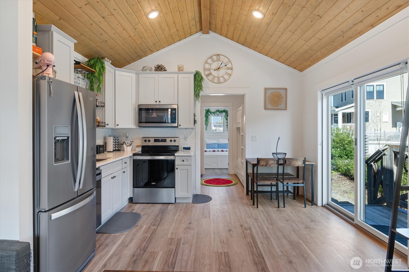 417 East Compass Street Pacific Beach, WA 98571 - Photo 9 of 40 a kitchen with stainless steel appliances a refrigerator and a stove top oven