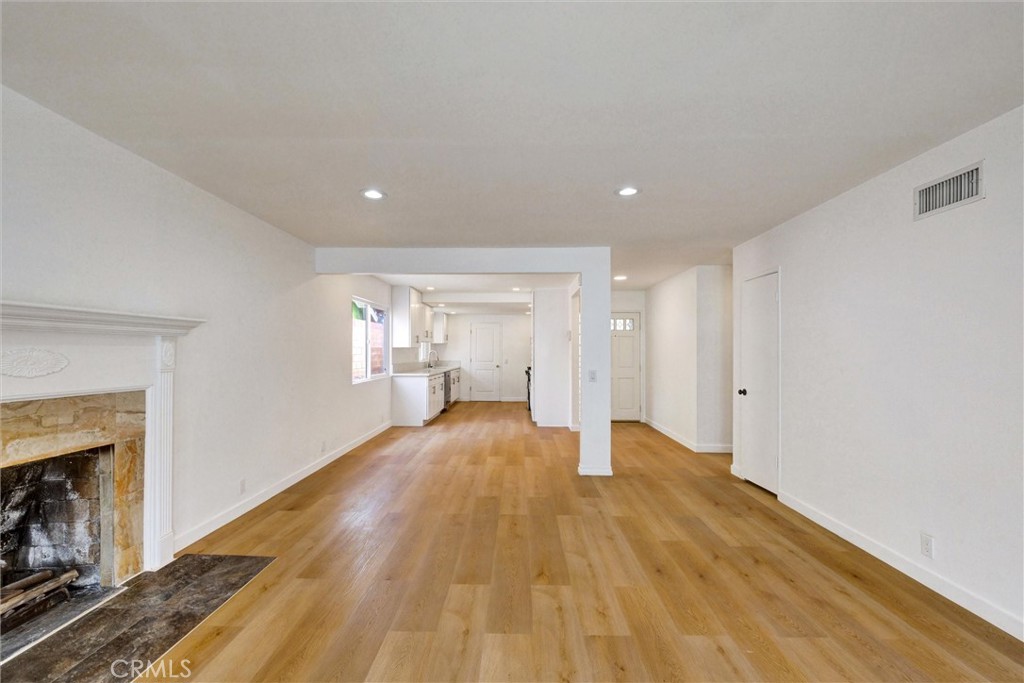 1807 East Calstock Street Carson, CA 90746 - Photo 5 of 11 a view of empty room with wooden floor