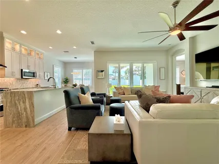 a kitchen with stainless steel appliances a stove a sink and a microwave