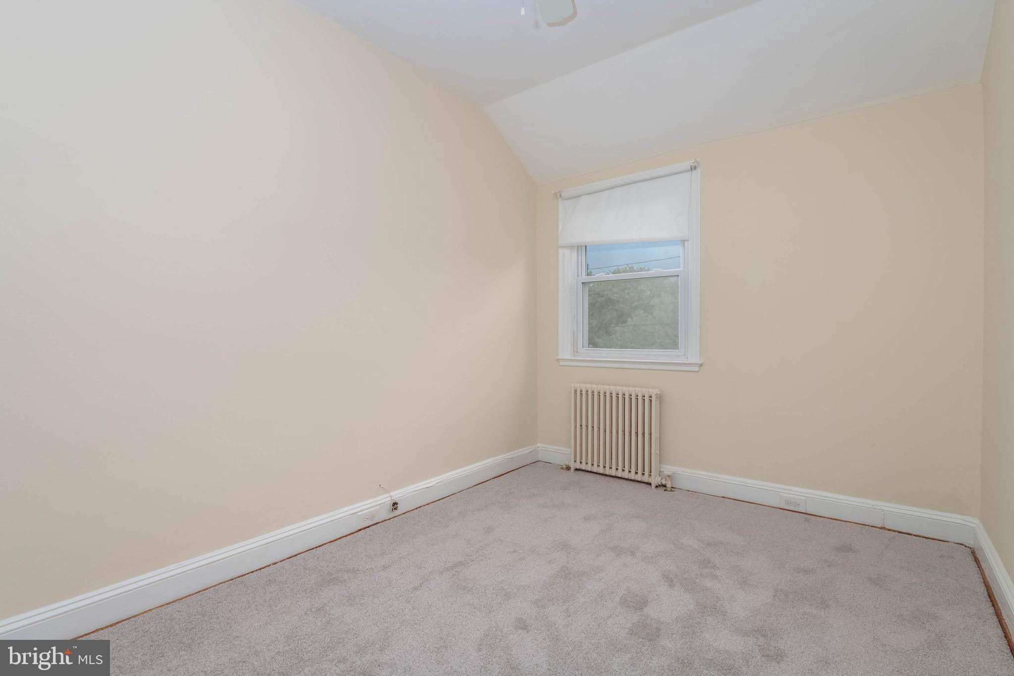 1325 Crofton Road Baltimore, MD 21239 - Photo 13 of 25 an empty room with a window