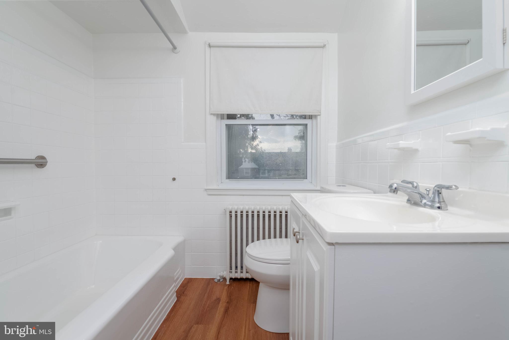 1325 Crofton Road Baltimore, MD 21239 - Photo 15 of 25 a bathroom with a sink toilet and a mirror
