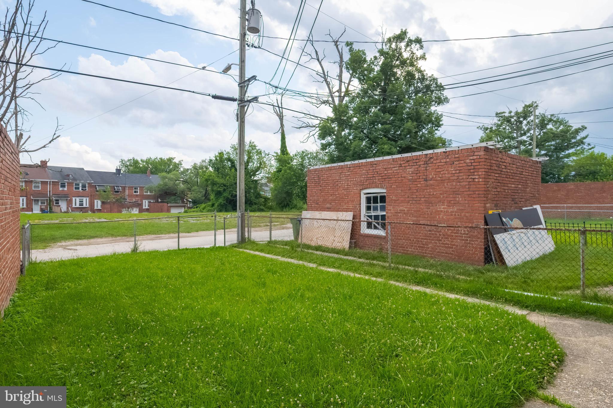 1325 Crofton Road Baltimore, MD 21239 - Photo 24 of 25 a view of a house with a yard