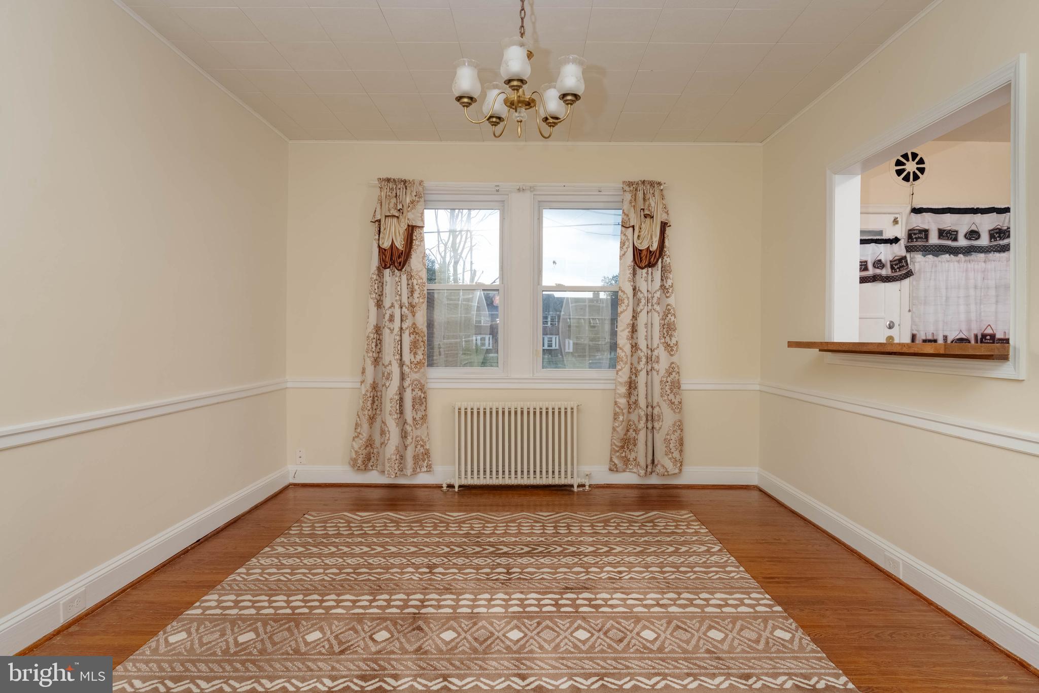 1325 Crofton Road Baltimore, MD 21239 - Photo 3 of 25 a view of a room with window and hardwood floor
