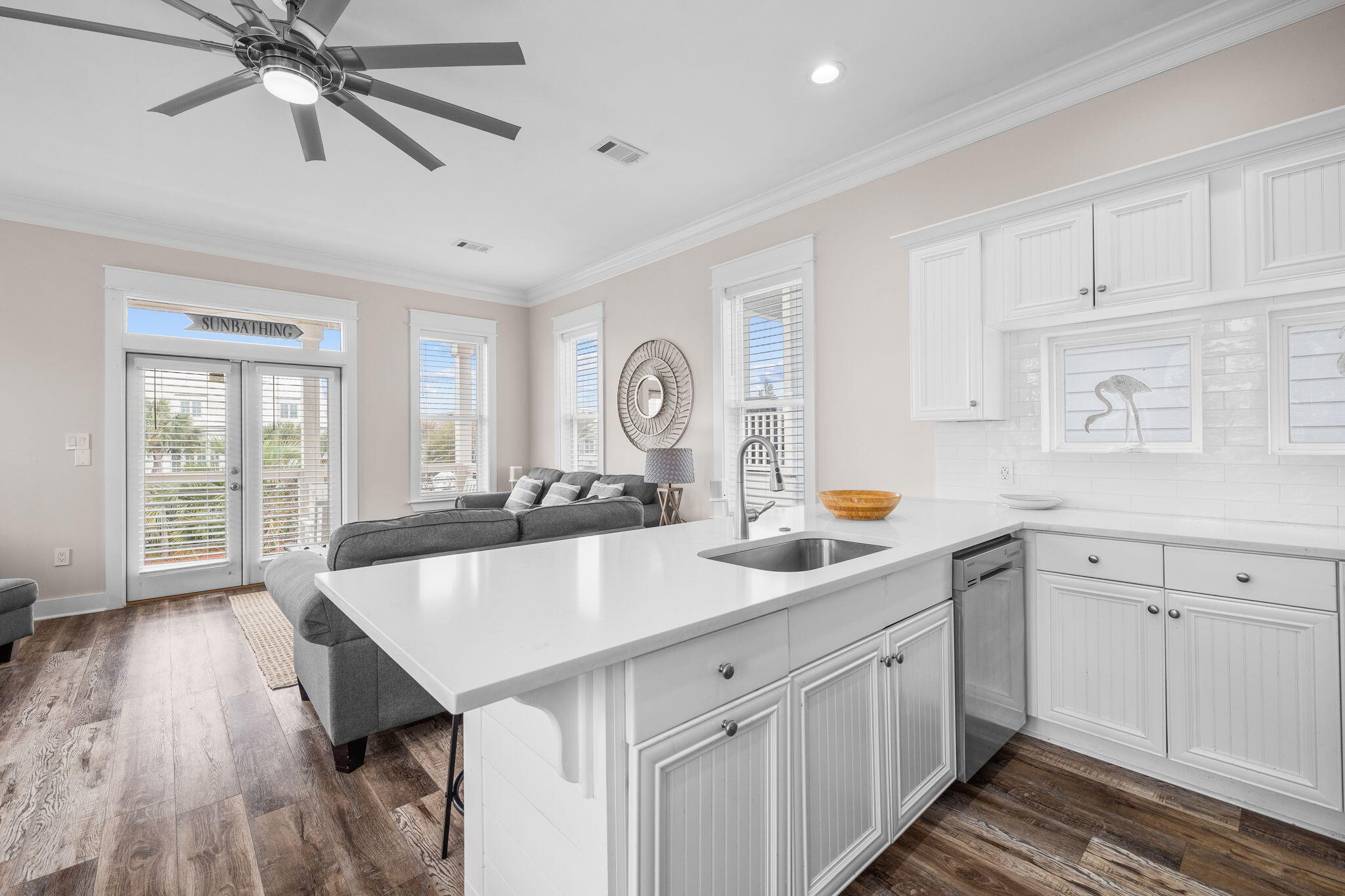 18 Trigger Trail East Inlet Beach, FL 32461 - Photo 16 of 44 a kitchen with white cabinets and wooden floor