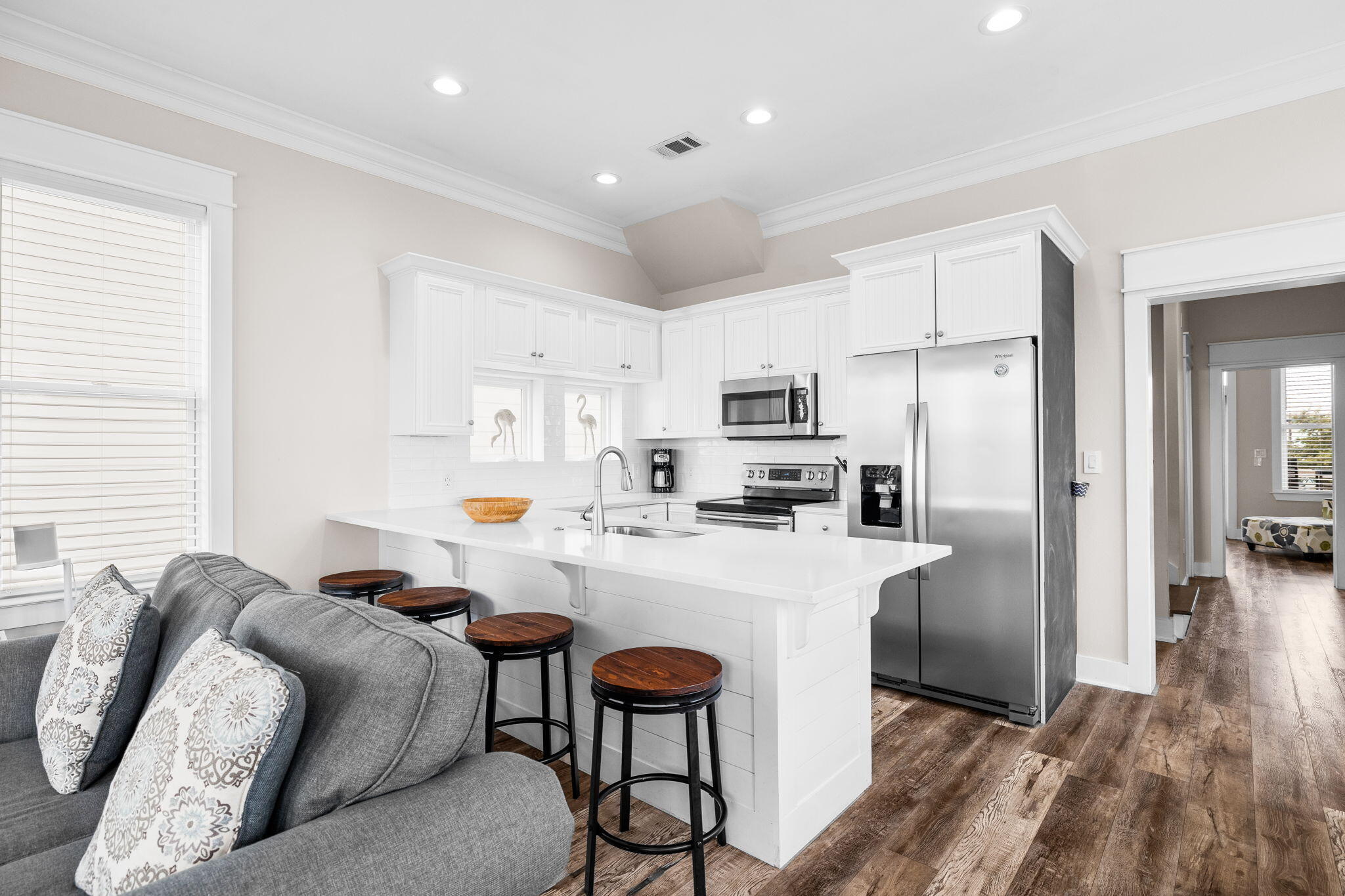 18 Trigger Trail East Inlet Beach, FL 32461 - Photo 17 of 44 a kitchen with stainless steel appliances a refrigerator a stove a sink dishwasher and a refrigerator with wooden floor