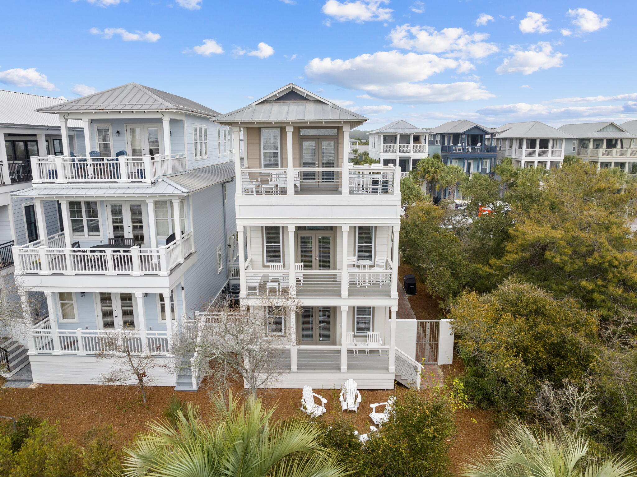 18 Trigger Trail East Inlet Beach, FL 32461 - Photo 38 of 44 a front view of a residential apartment building with a yard