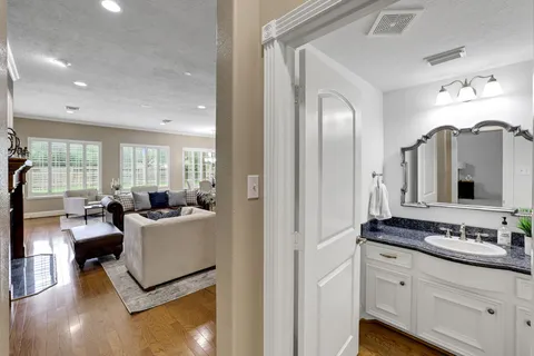 a view of living room with furniture and large windows