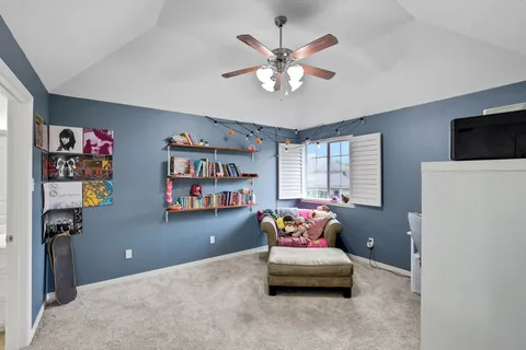 a bedroom with furniture and a window