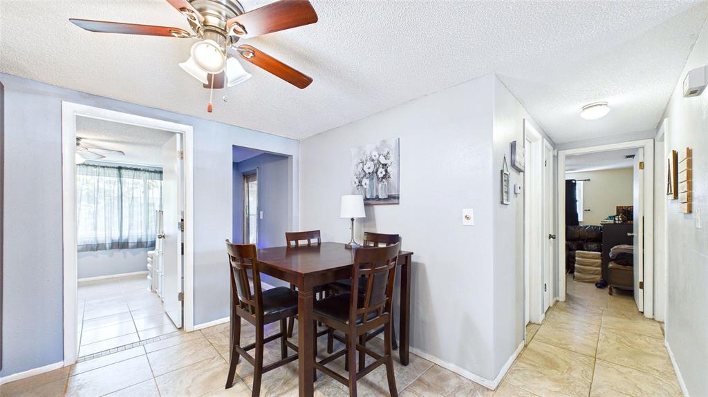 8840 Carmen Lane Port Richey, FL 34668 - Photo 12 of 49 a view of a dining room with furniture