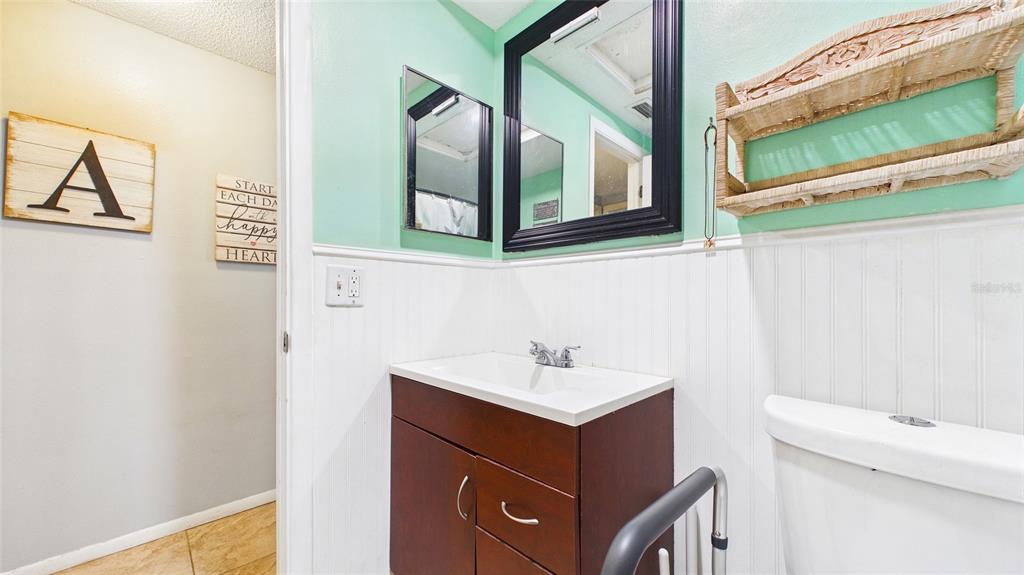 8840 Carmen Lane Port Richey, FL 34668 - Photo 23 of 49 a bathroom with a sink and a mirror