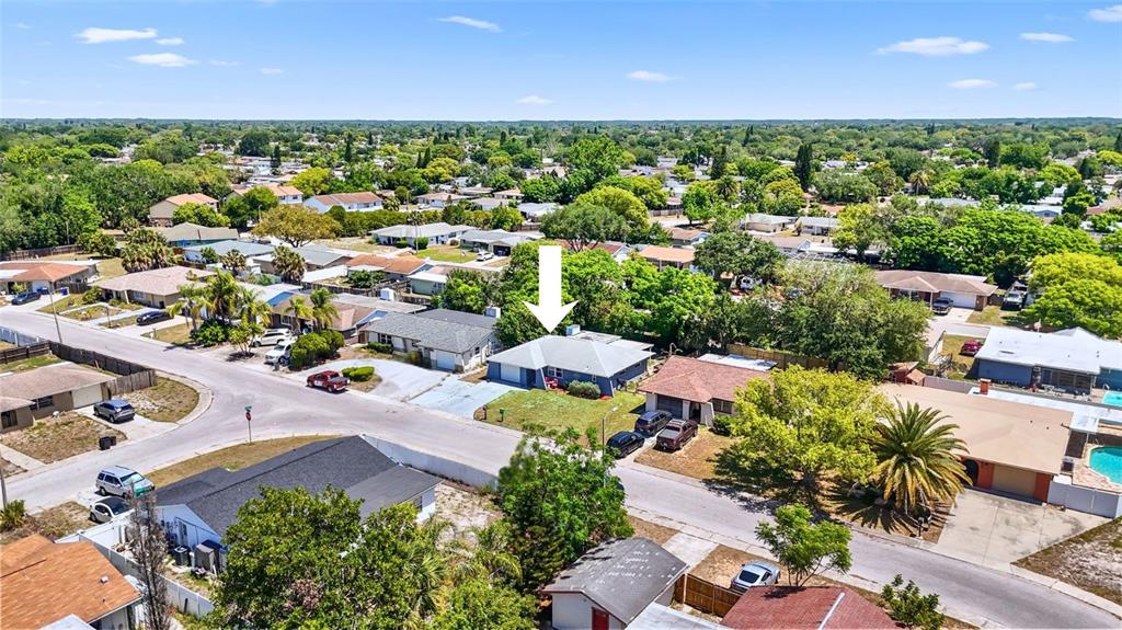 8840 Carmen Lane Port Richey, FL 34668 - Photo 48 of 49 an aerial view of a house with a garden