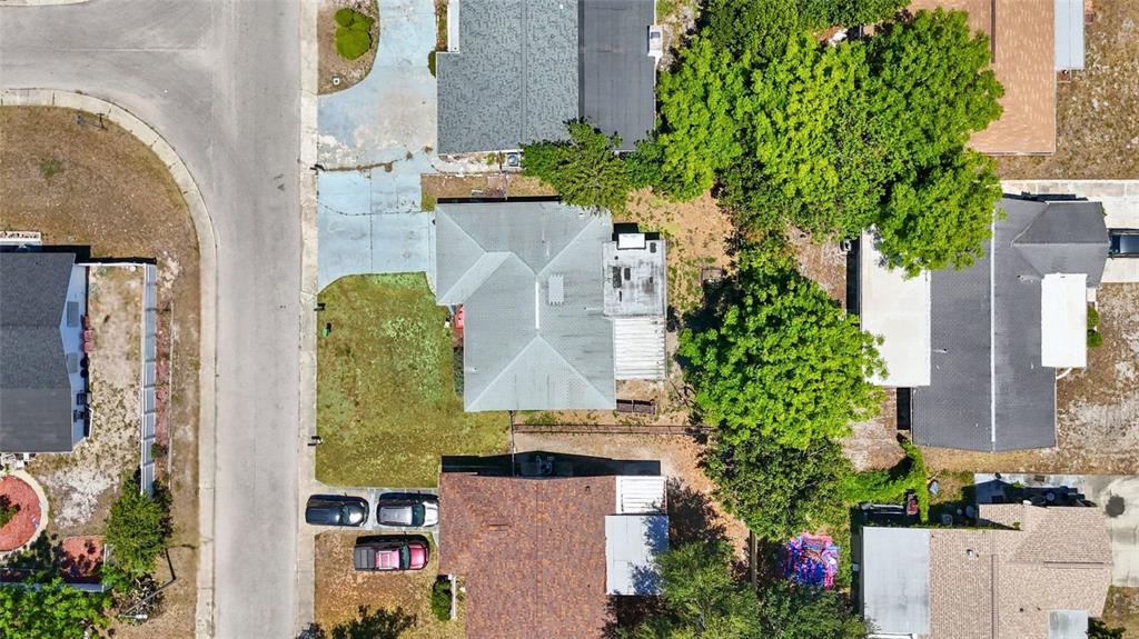8840 Carmen Lane Port Richey, FL 34668 - Photo 49 of 49 an aerial view of a residential apartment building with a yard and potted plants