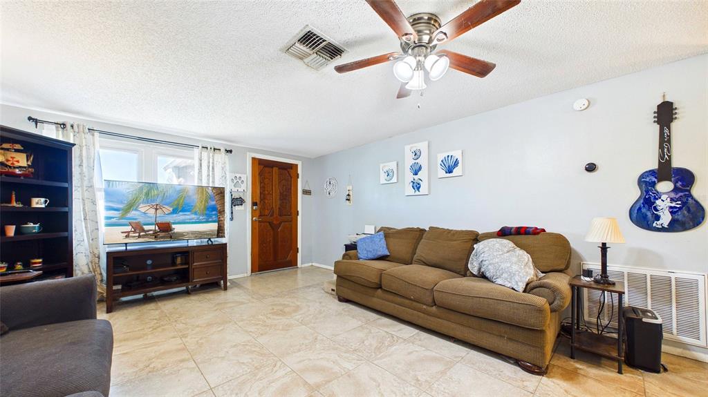 8840 Carmen Lane Port Richey, FL 34668 - Photo 6 of 49 a living room with furniture and a window
