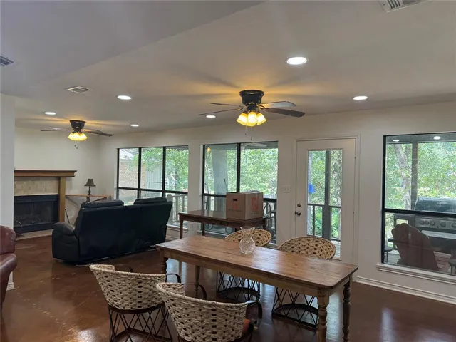 a view of a dining room with furniture window and outside view