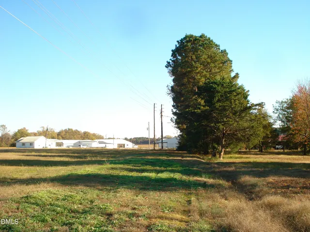 a view of swimming pool is middle in the middle of a yard