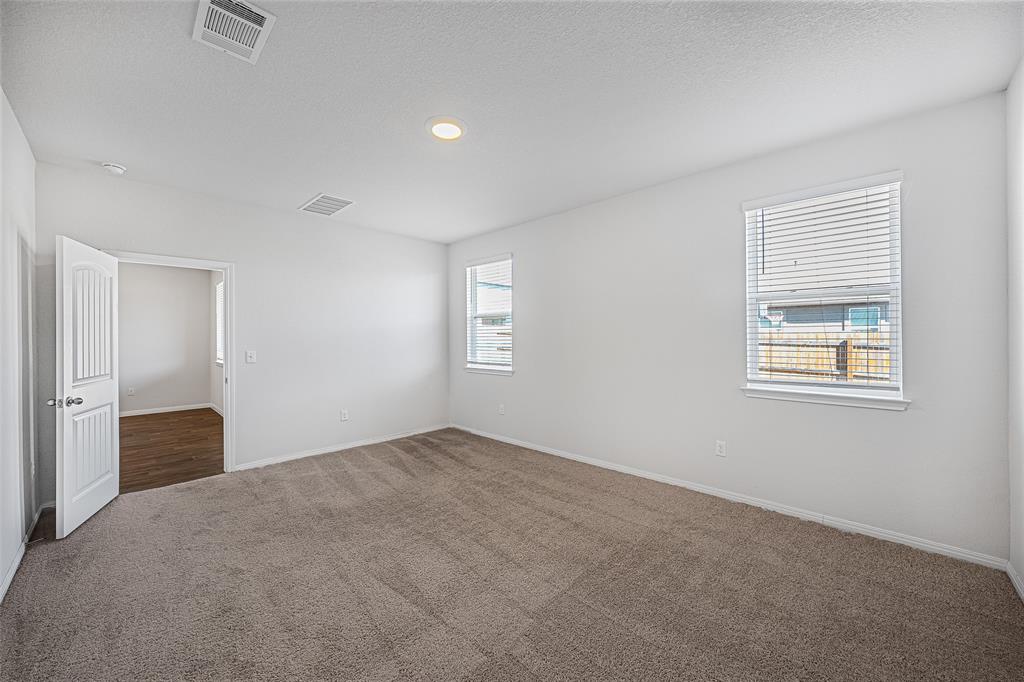 121 Mackinac Lane Georgetown, TX 78626 - Photo 7 of 16 a view of an empty room with a window