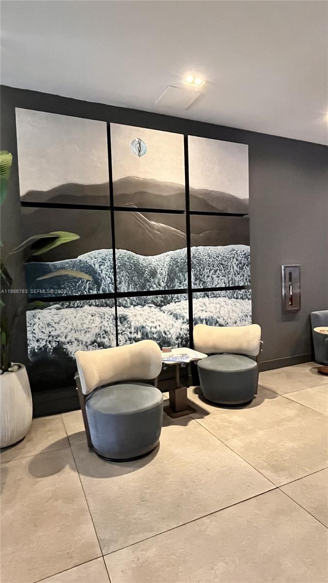 229 Southwest 9th Street, Unit 307 Miami, FL 33130 - Photo 28 of 36 a living room with furniture and a floor to ceiling window