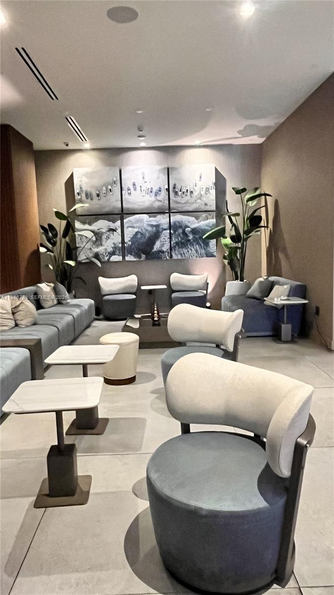 229 Southwest 9th Street, Unit 307 Miami, FL 33130 - Photo 29 of 36 a living room with couches and a pool table