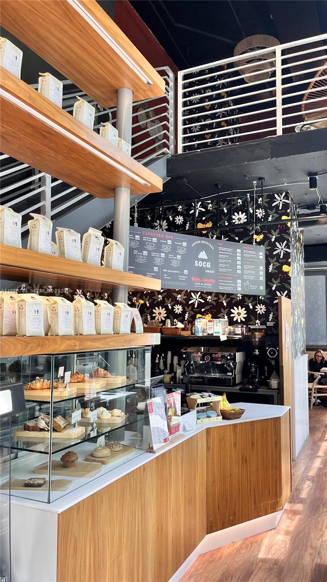 229 Southwest 9th Street, Unit 307 Miami, FL 33130 - Photo 35 of 36 a view of a store with a chair and tables