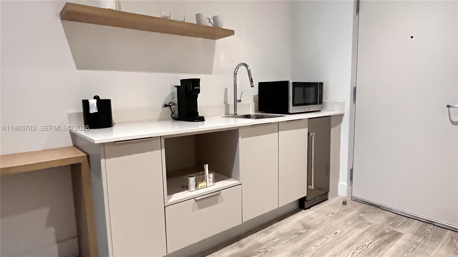 229 Southwest 9th Street, Unit 307 Miami, FL 33130 - Photo 7 of 36 a view of a kitchen with electric appliances