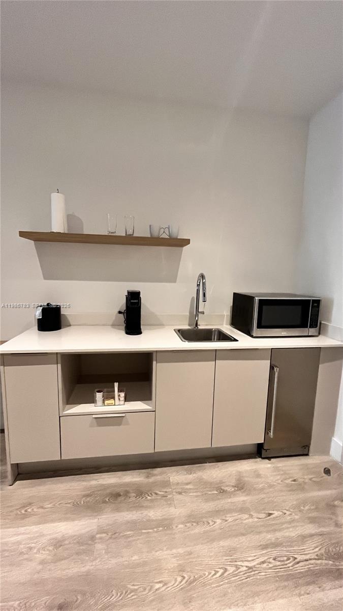 229 Southwest 9th Street, Unit 307 Miami, FL 33130 - Photo 8 of 36 a view of kitchen with stainless steel appliances granite countertop a sink and a stove