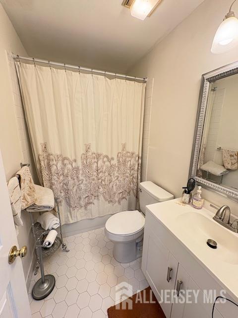 71B Winthrop Road Monroe Township, NJ 08831 - Photo 11 of 15 a bathroom with a sink toilet and shower
