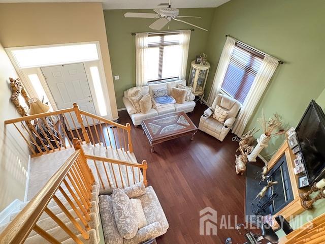 71B Winthrop Road Monroe Township, NJ 08831 - Photo 2 of 15 a living room with couches bookshelf and a flat screen tv