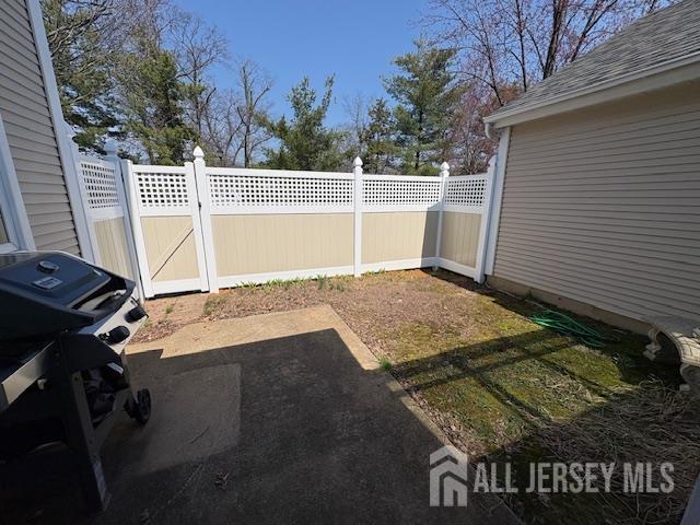 71B Winthrop Road Monroe Township, NJ 08831 - Photo 7 of 15 a view of backyard with wooden fence