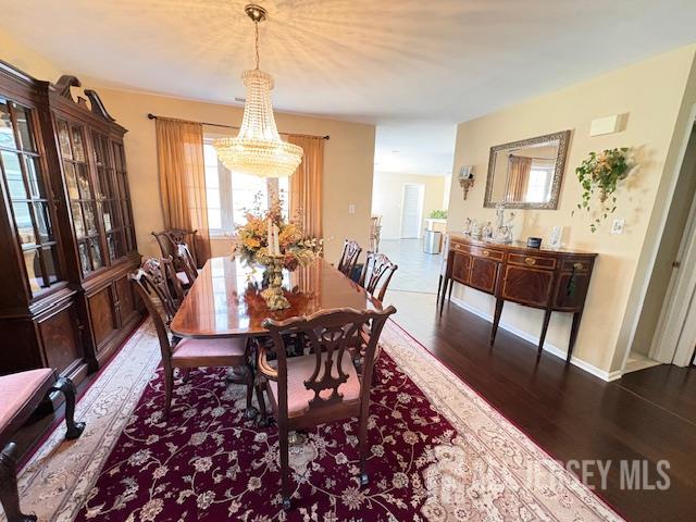 71B Winthrop Road Monroe Township, NJ 08831 - Photo 8 of 15 a view of a dining room with furniture window and wooden floor