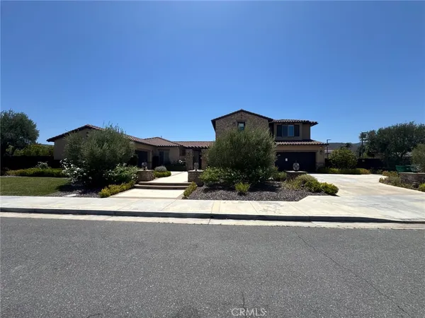 a view of a house with a street