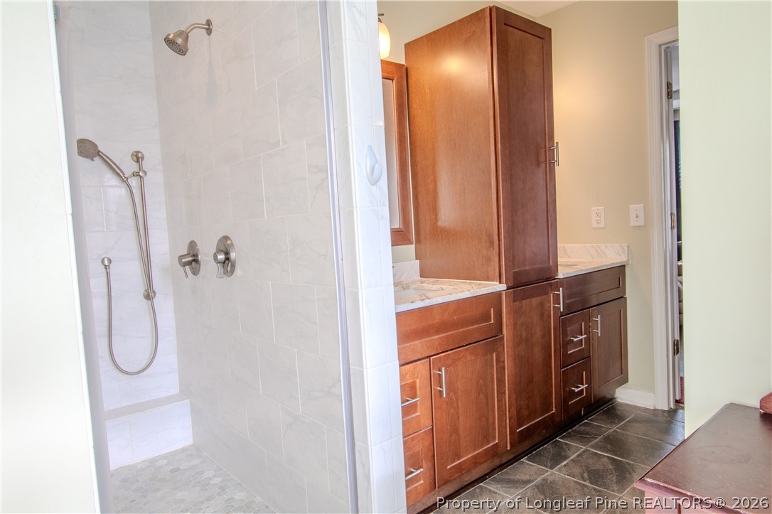 1629 Mattie Road Sanford, NC 27332 - Photo 12 of 29 a bathroom with a shower and a mirror