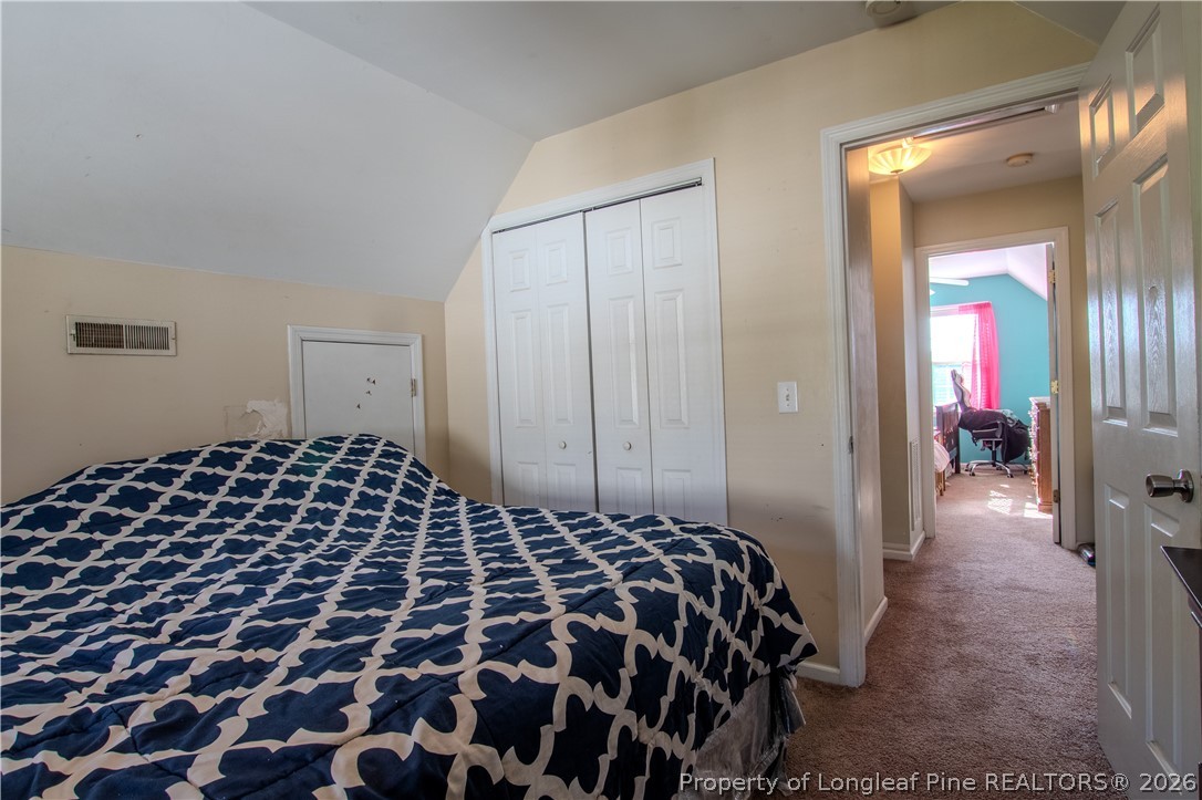 1629 Mattie Road Sanford, NC 27332 - Photo 14 of 29 a bedroom with a bed and closet