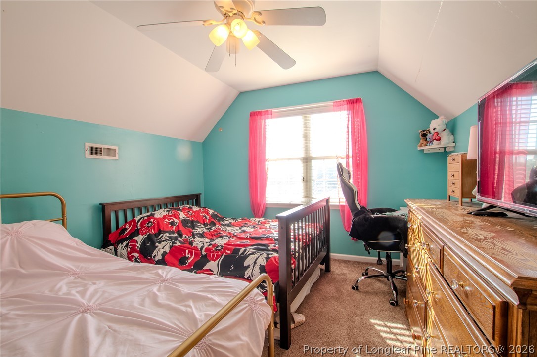 1629 Mattie Road Sanford, NC 27332 - Photo 17 of 29 a bedroom with a bed and a window