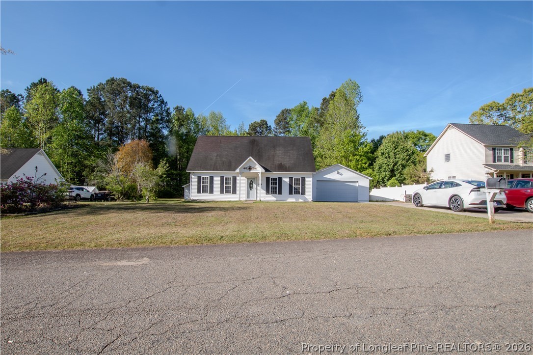 1629 Mattie Road Sanford, NC 27332 - Photo 2 of 29 a front view of house with yard and trees in the background
