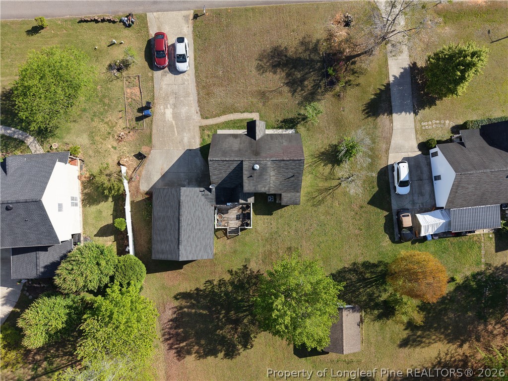 1629 Mattie Road Sanford, NC 27332 - Photo 21 of 29 an aerial view of residential house with yard and parking