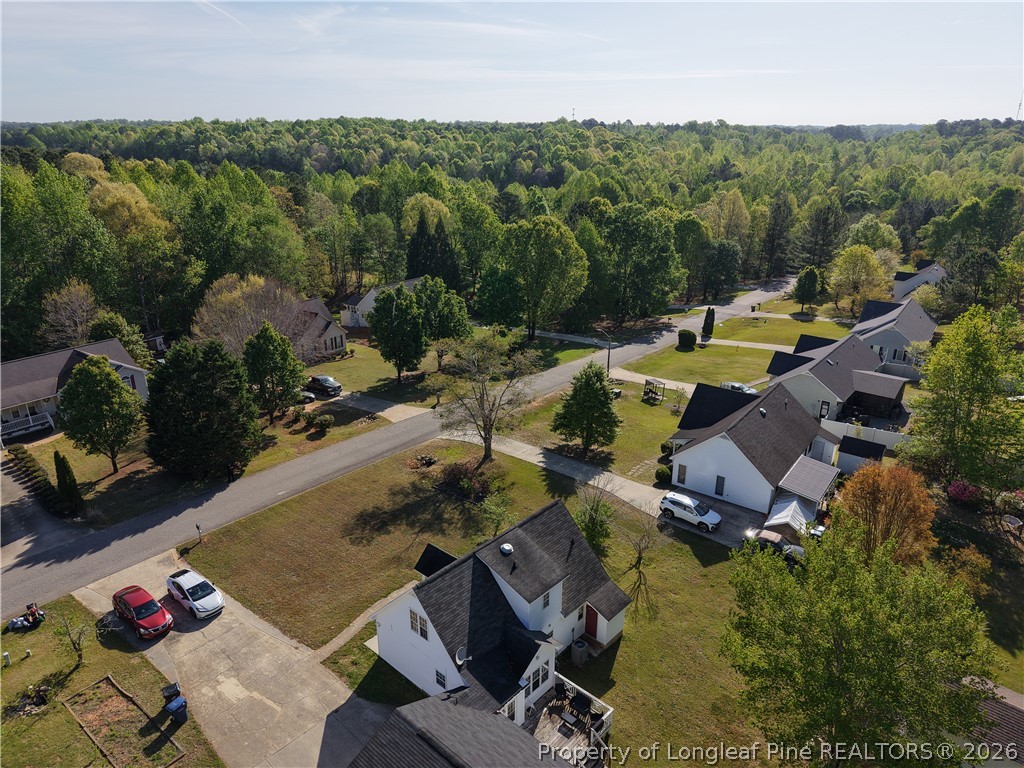 1629 Mattie Road Sanford, NC 27332 - Photo 22 of 29 an aerial view of a house with a swimming pool